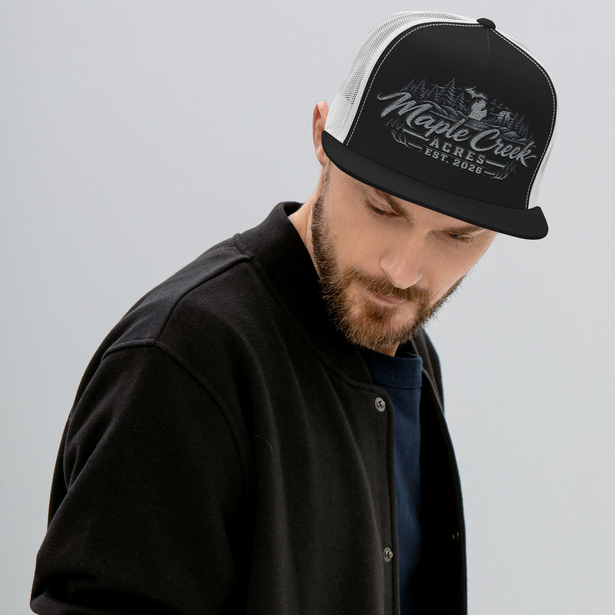 Maple Creek Acres Flat-Bill Trucker Cap in Black/White — front view